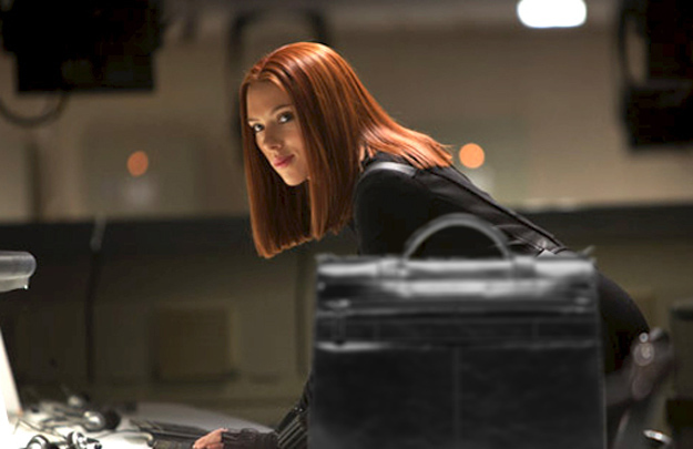 She could stand behind a series of oversize briefcases.