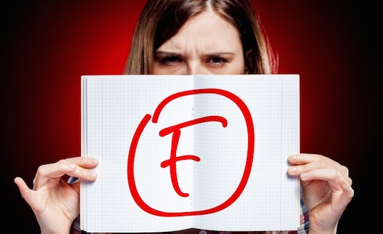 Failed test or exam and disappointed girl