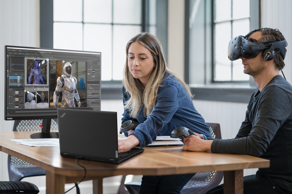 A woman places a virtual reality tracker, to begin a business meeting.